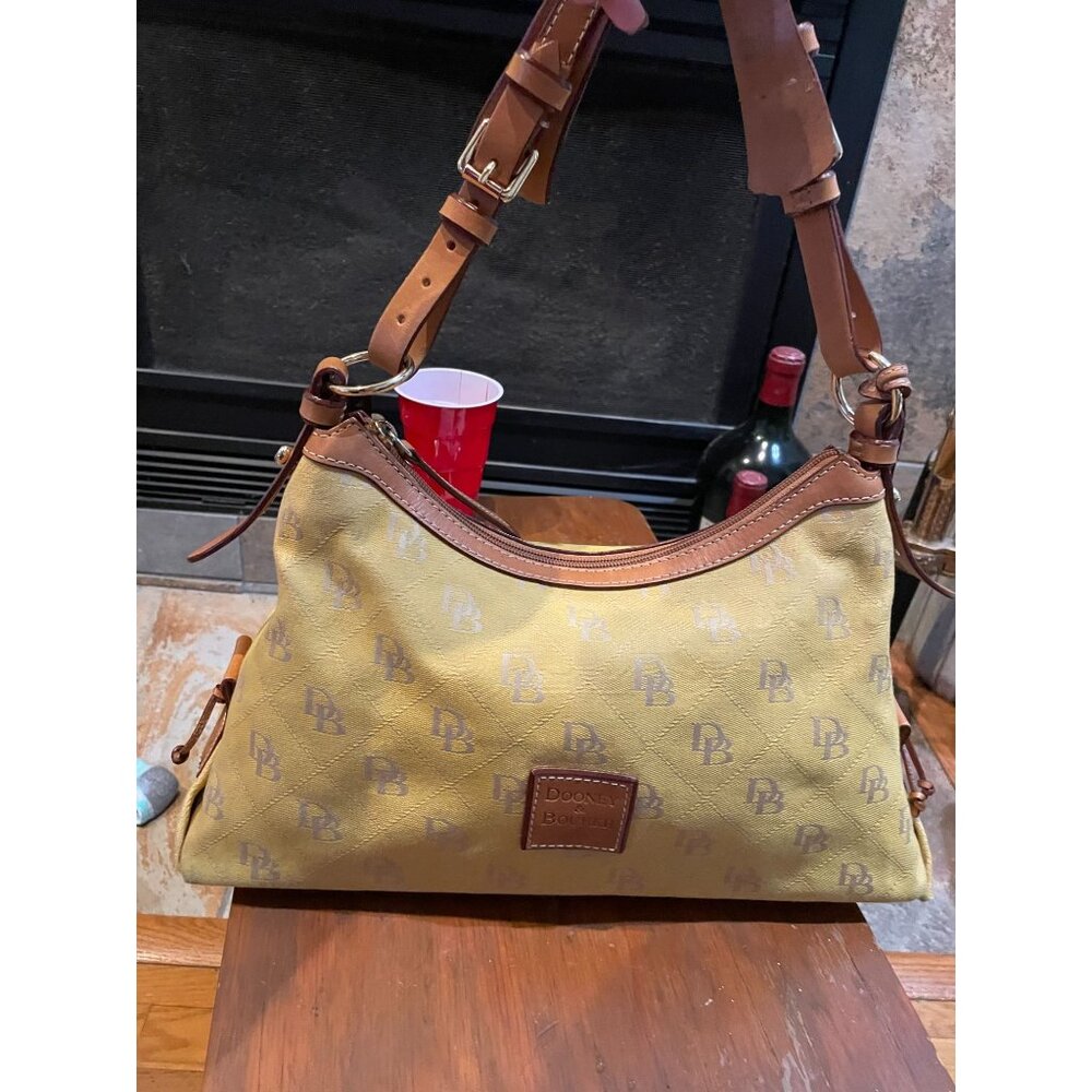 B204 - Dooney & Bourke Signature monogram canvas shoulder bag.